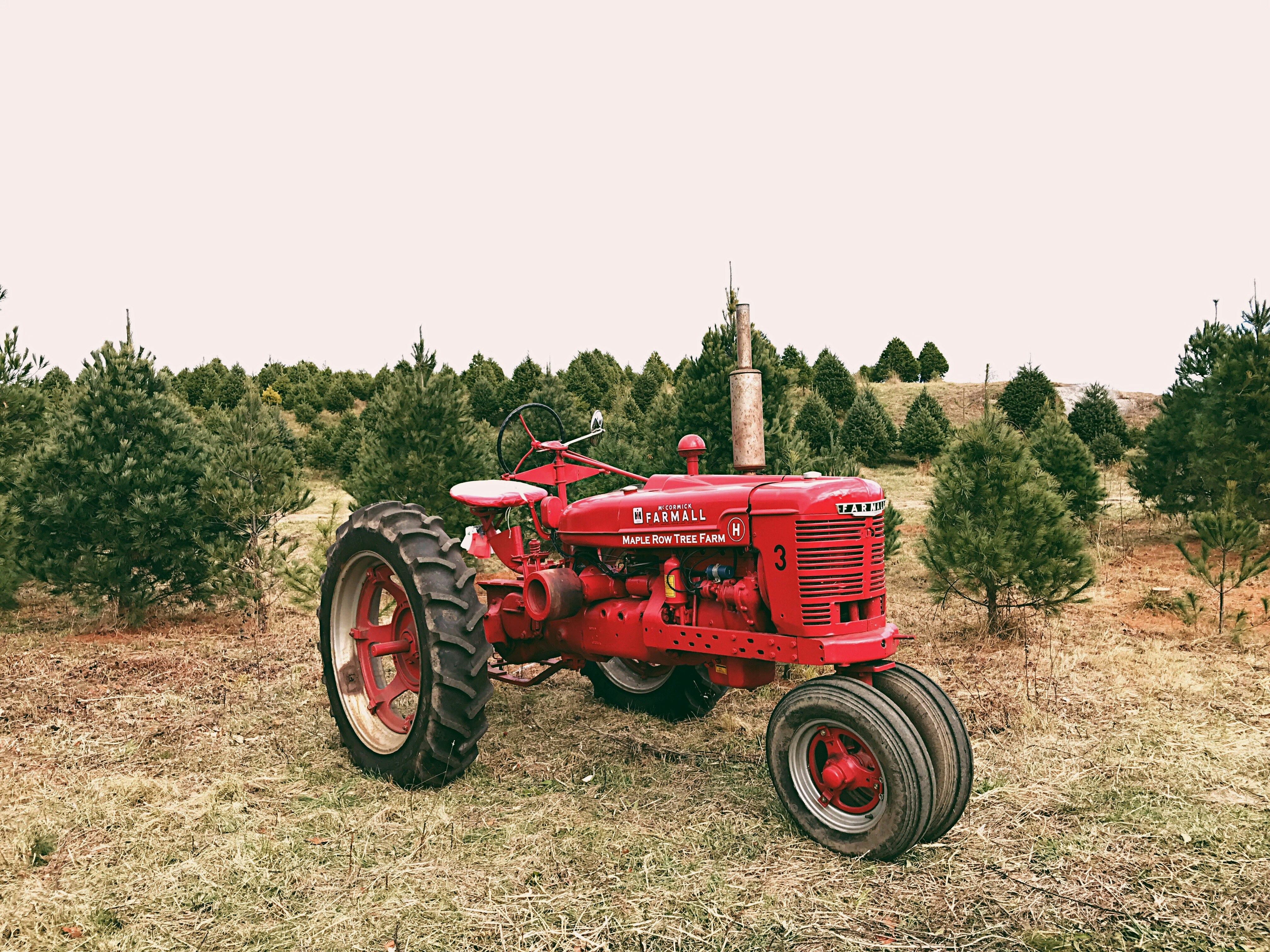 red and black tractor during daytime